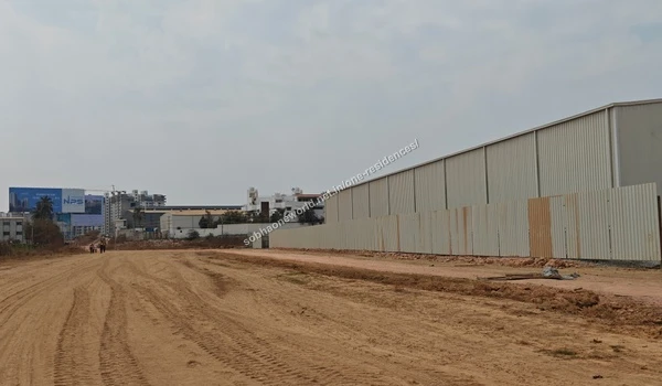 Broad landscape view capturing the temporary administrative warehouse and ground preparation at Sobha One Residences