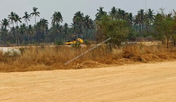 Broad Site Expanse Wide view of the fully cleared and leveled sandy grounds prepared for the Sobha One Residences property