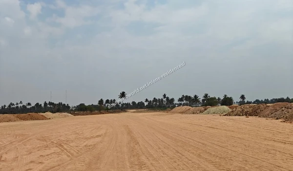 Land Preparation Expansive view of the cleared land preparation for Sobha One Residences with distant trees