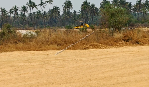 Earth Levelling Materials Long stretch of staged earth materials gathered for upcoming terrain leveling at the Sobha One Residences plot