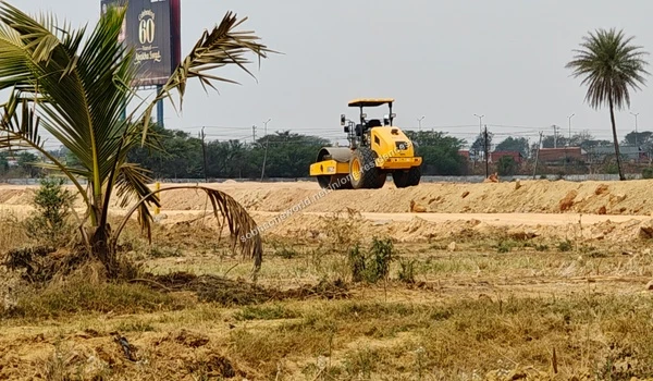 Earth Storage Multiple excavated earth mounds stored across the graded construction area of Sobha One Residences
