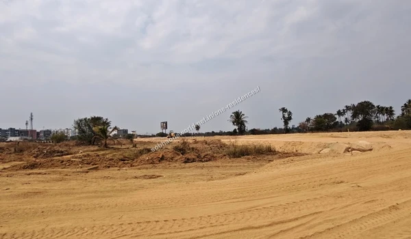 Pathway Grading Cleared and graded dirt pathways curving towards the site perimeter at Sobha One Residences