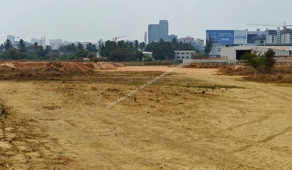 Sandy Terrain Sandy leveled terrain and internal pathways marked by tire tracks at the Sobha One Residences location