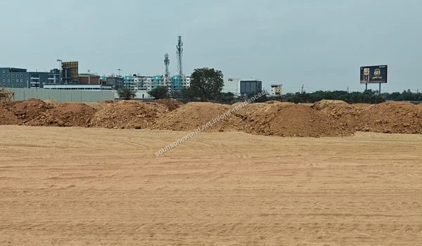 Staged Earth Materials Mounds of staged earth materials gathered along the boundary of the Sobha One Residences development