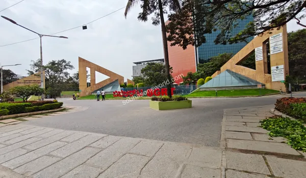Impressive modern architecture of nearby business parks featuring tall decorative pillars and glass facades close to Sobha One World