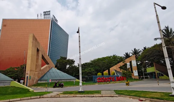 Tall commercial tower with a striking glass facade standing as a prominent landmark in the tech district near Sobha One World