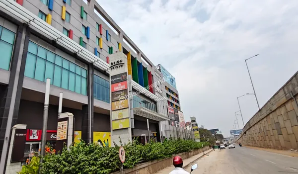 The expansive exterior wall of the lifestyle mall, highlighting the complete array of recreational facilities available to the Sobha One World neighborhood.