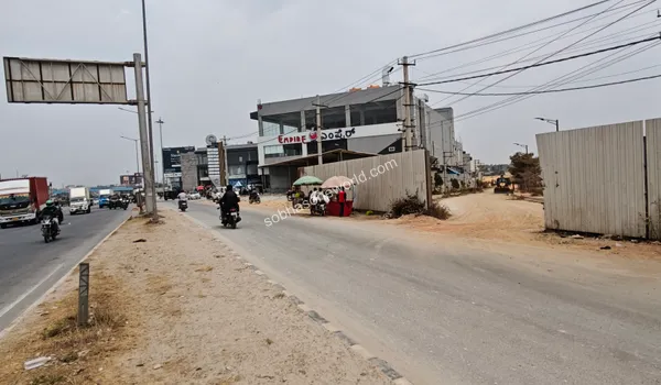 The street corner marked by the Empire building, indicating the turn towards the Sobha One World development site.