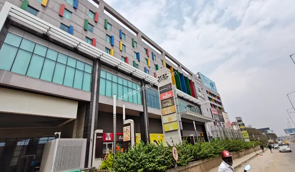 The street view of international food and beverage outlets located at the ground level of the commercial plaza near Sobha One World.