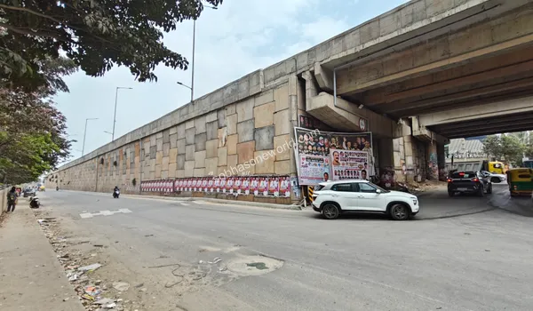 Wide service roads running alongside the major highway junction connecting Whitefield and Sobha One World