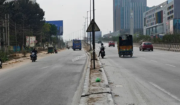 View of the modern road dividers and highway infrastructure facilitating smooth transit around the Sobha One World vicinity