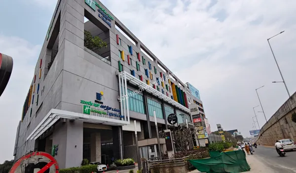 Grand shopping mall atriums featuring seasonal events and luxury brand showcases near Sobha One World