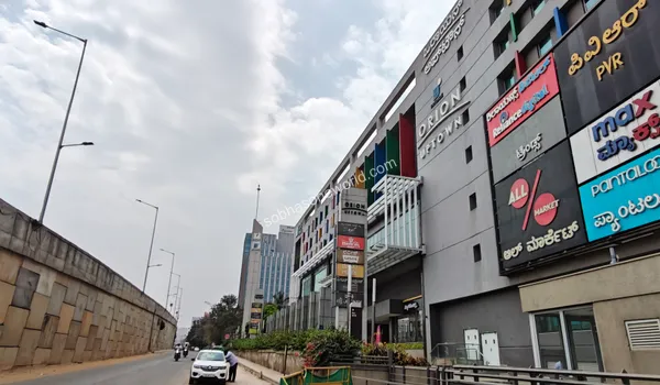 The towering structure of the local urban mall acting as a prime lifestyle and recreational landmark for families residing in Sobha One World.