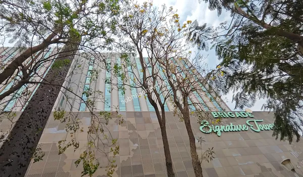 Modern exterior of the business park showcasing the vibrant commercial ecosystem surrounding the Sobha One World property