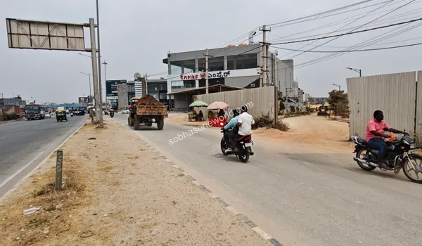 The evolving roadside landscape and infrastructural improvements happening adjacent to the Sobha One World campus.