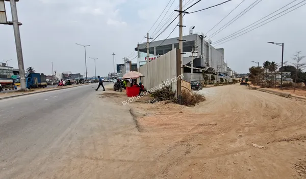 The ongoing development of sidewalks and pedestrian pathways near the immediate entrance of Sobha One World.