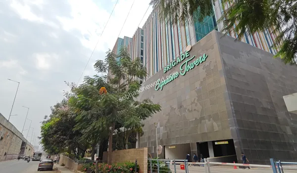 Towering office buildings and unique triangular architecture at the tech park located a short drive from Sobha One World
