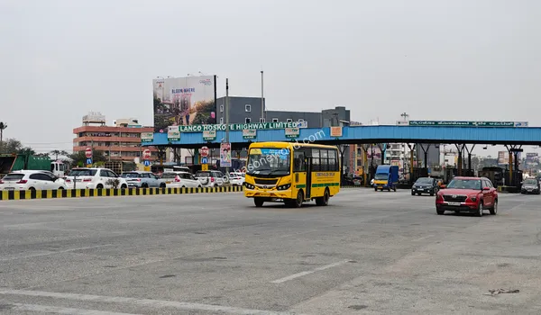 Evening view of the well-lit Hoskote Toll plaza highlighting safe night-time travel to Sobha One World